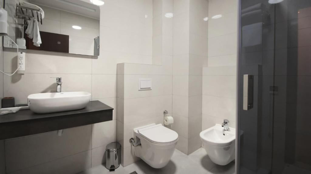 Koupelna v ubytování Hotel Callisto
