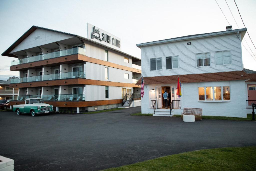 a building with a car parked in front of it at York Beach Surf Club in York