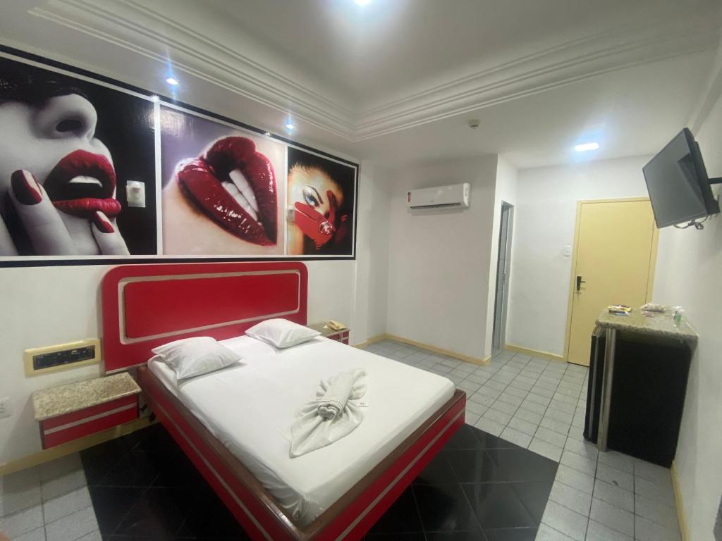Postel nebo postele na pokoji v ubytování Hotel Bom Gosto