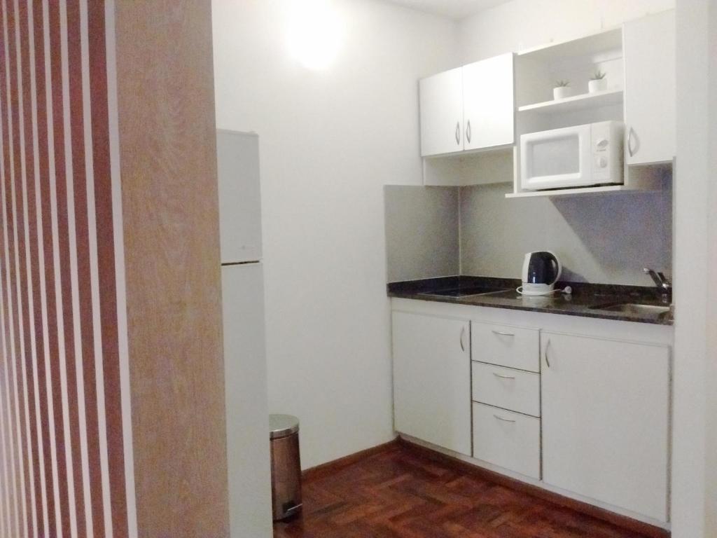 Kuchyň nebo kuchyňský kout v ubytování Departamentos Lugar