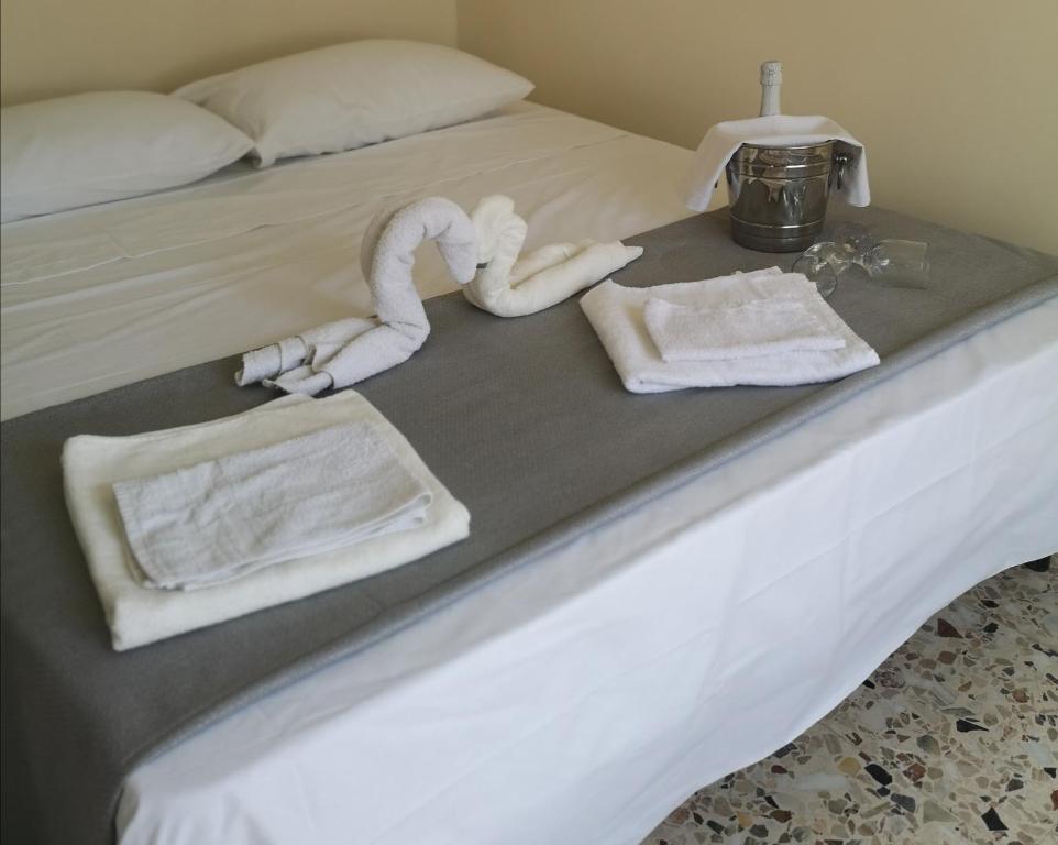 Un pat sau paturi într-o cameră la Casa Giordalisia