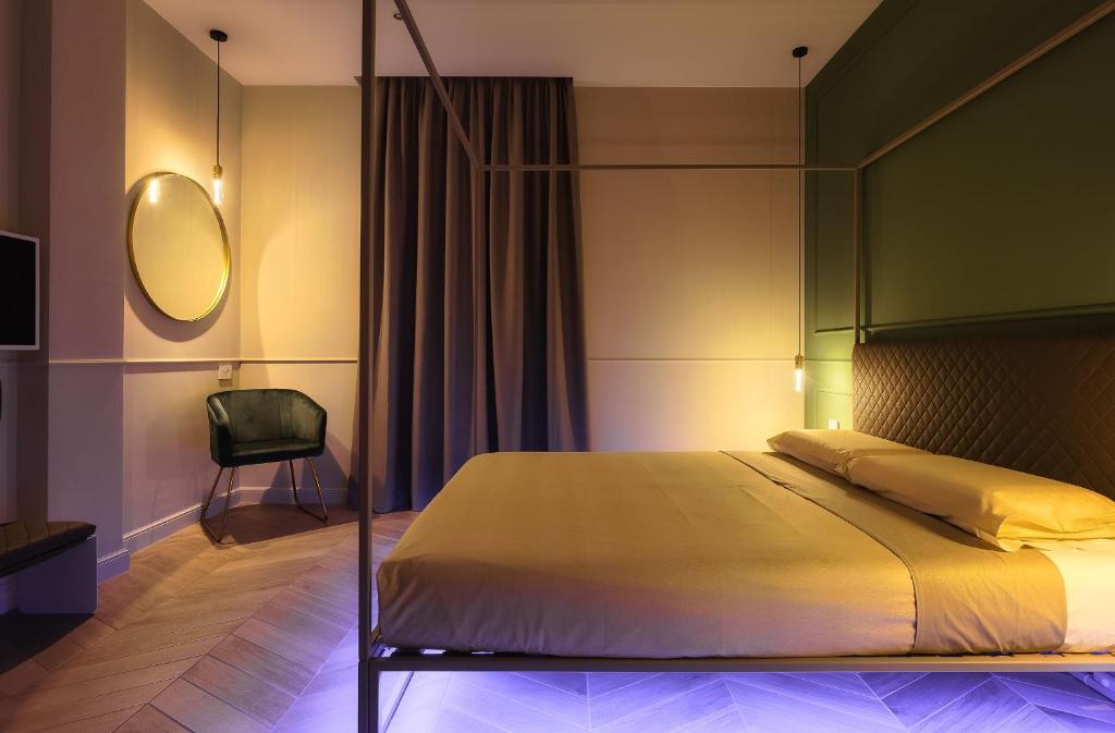 Łóżko lub łóżka w pokoju w obiekcie Casa Duomo Luxury Suites