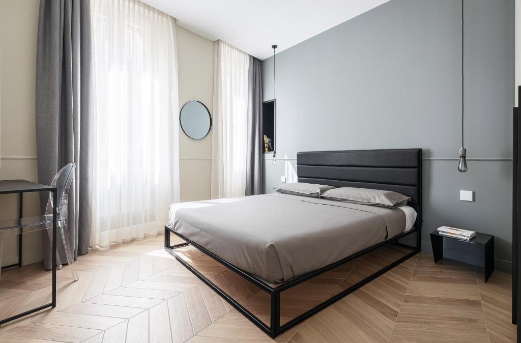 Łóżko lub łóżka w pokoju w obiekcie Casa Duomo Luxury Suites