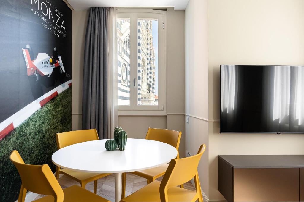 Telewizja i/lub zestaw kina domowego w obiekcie Casa Duomo Luxury Suites