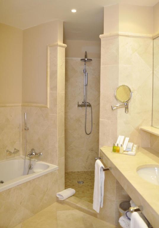a bathroom with a shower and a tub and a sink at SH Villa Gadea in Altea