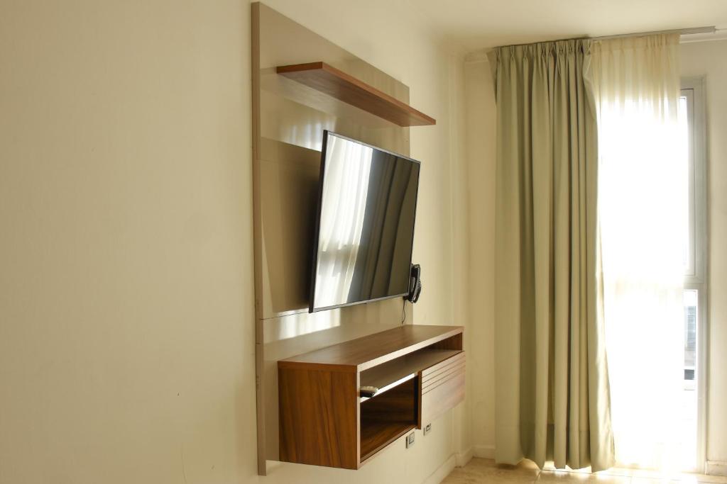 TV a/nebo společenská místnost v ubytování La Gioconda Apart Hotel