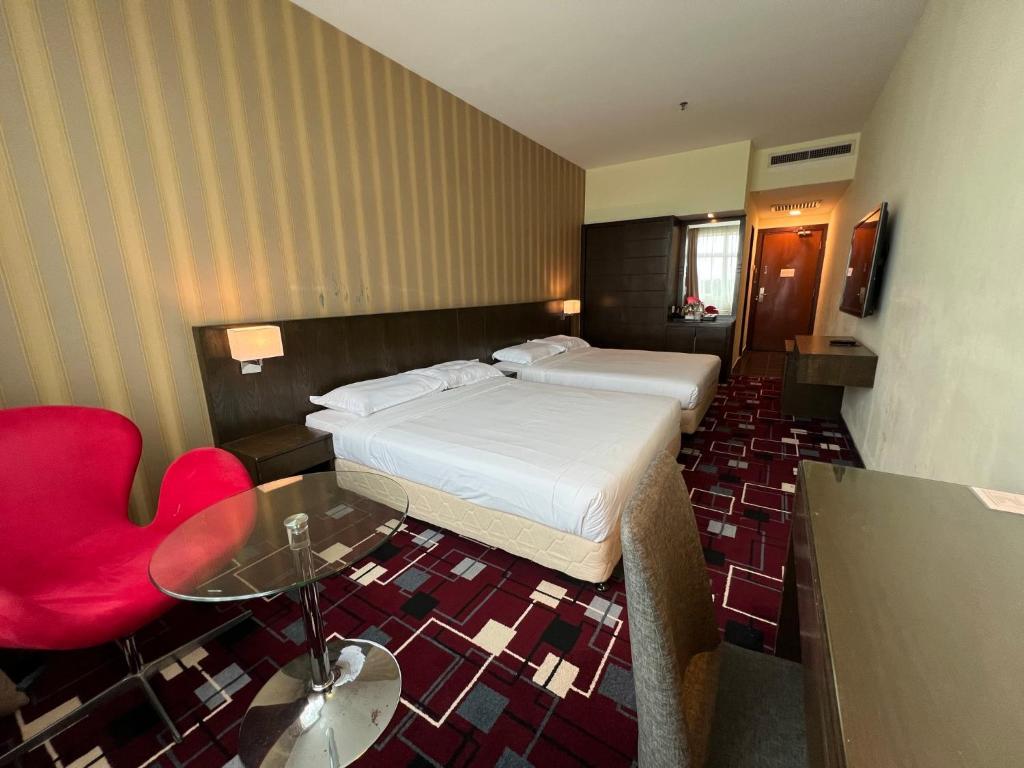 Postel nebo postele na pokoji v ubytování SSL Traders Hotel