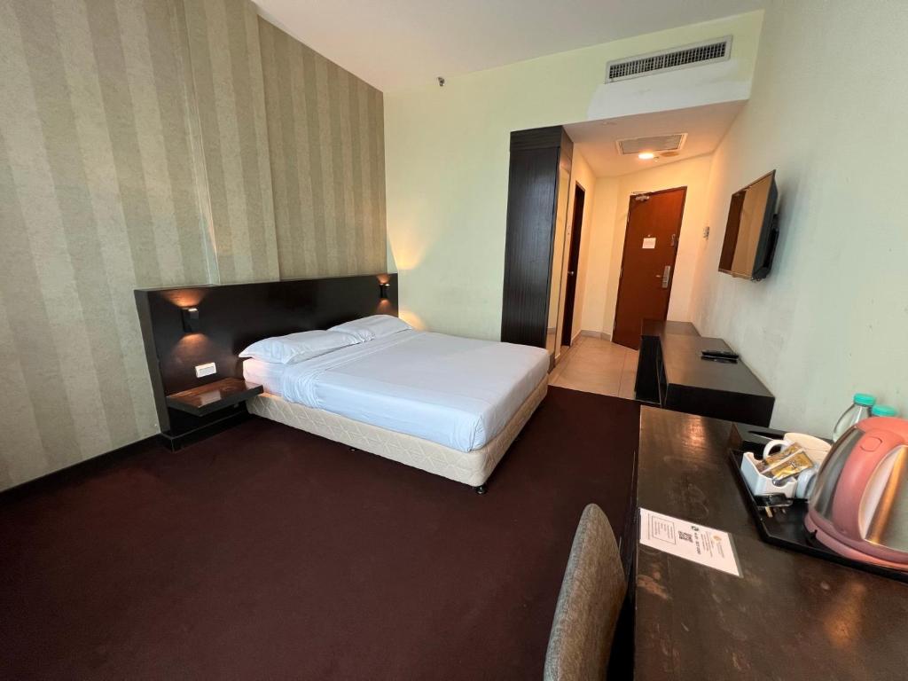 Postel nebo postele na pokoji v ubytování SSL Traders Hotel