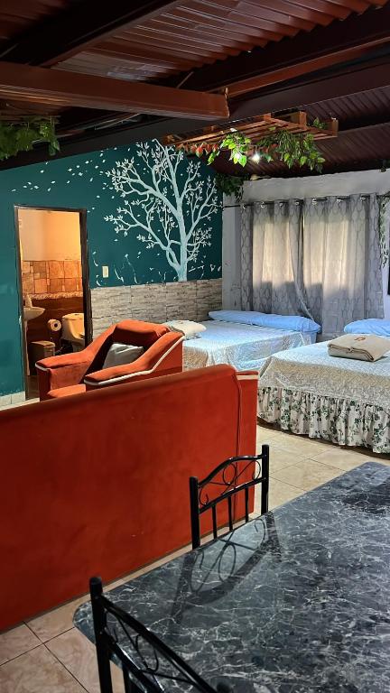 Una cama o camas en una habitación de Bambito´s Café & Hostel