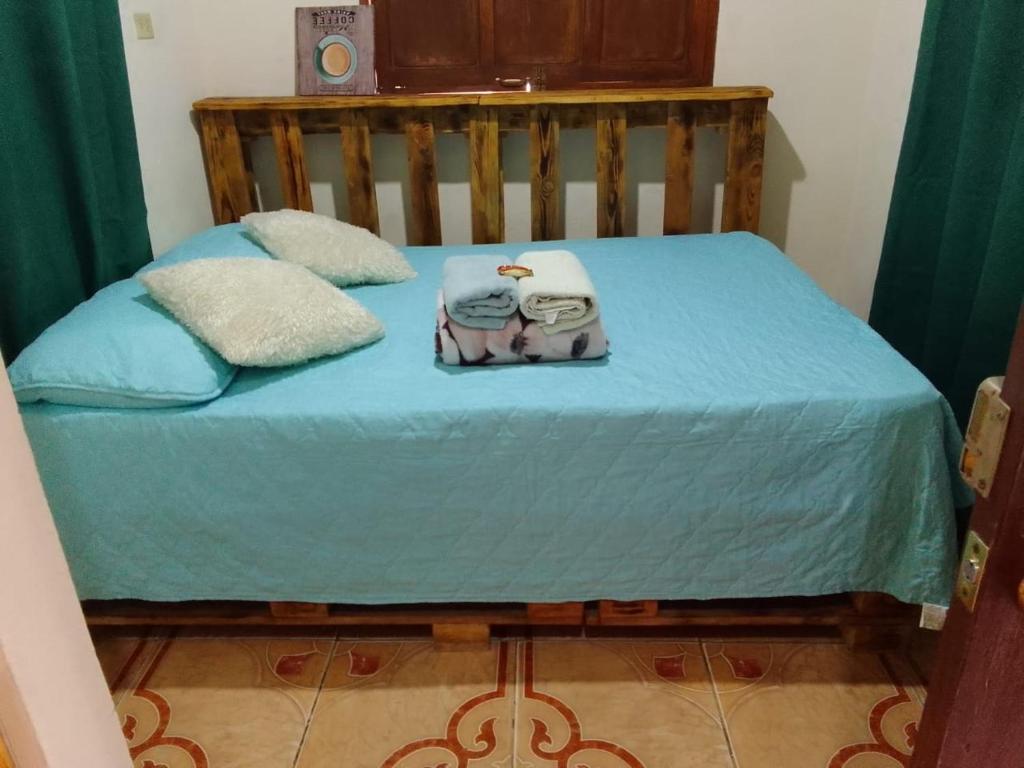 Una cama o camas en una habitación de Bambito´s Café & Hostel