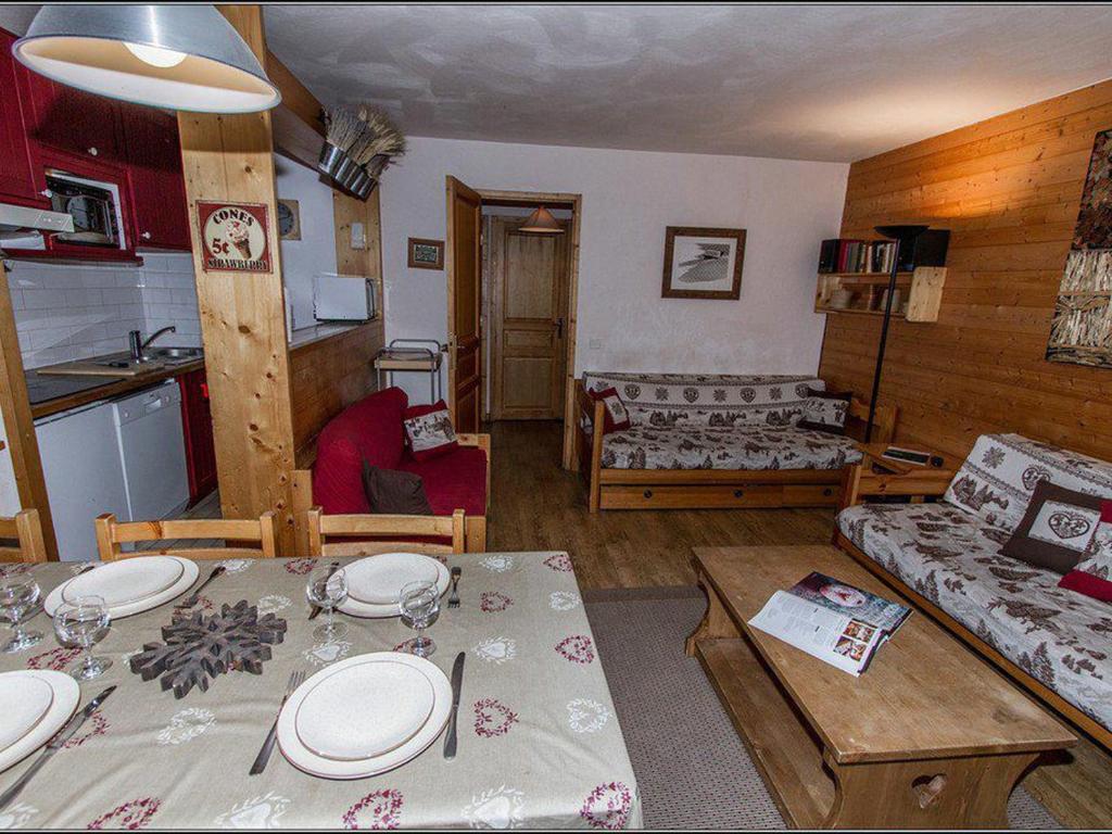 a living room with a dining table and a kitchen at Appartement Val-d'Isère, 5 pièces, 8 personnes - FR-1-518-104 in Val-d'Isère