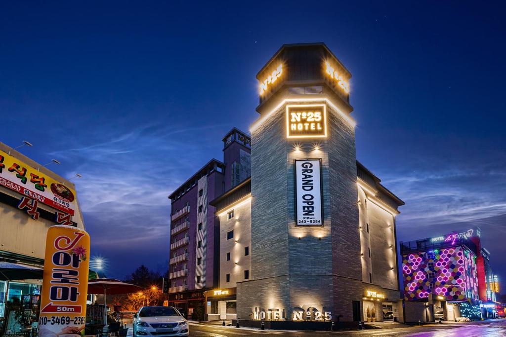 a building with a sign on the side of it at No25 Hotel Jeonju Sanjeong in Jeonju