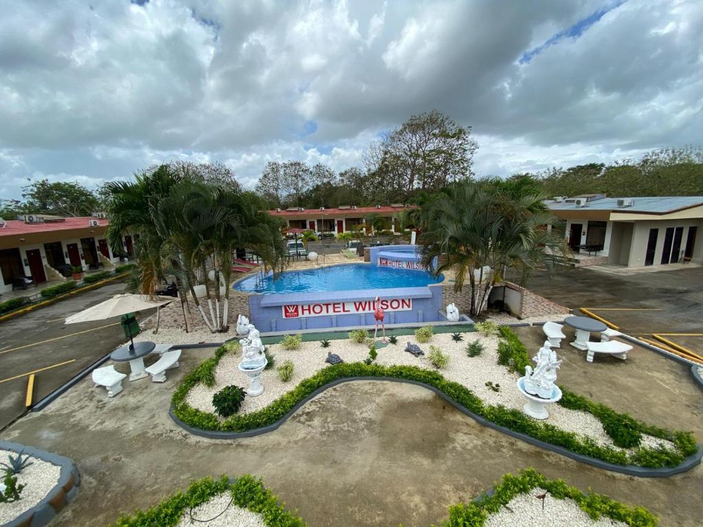 an aerial view of a hotel with a swimming pool at Hotel Wilson Upala in Upala