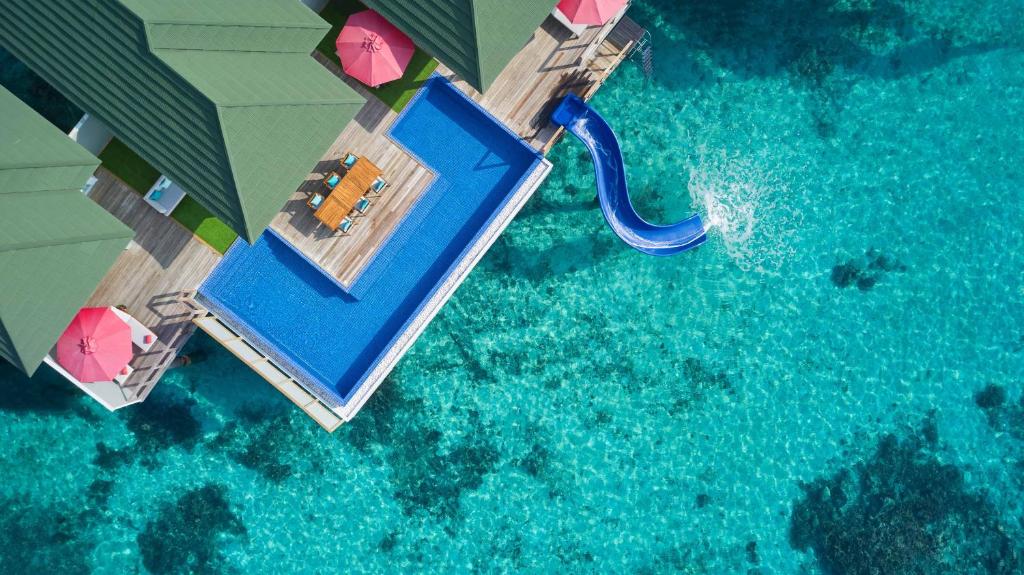 an aerial view of a swimming pool in the water at Siyam World Maldives - 24-Hour Premium All-inclusive with Free Transfer in Dhigurah