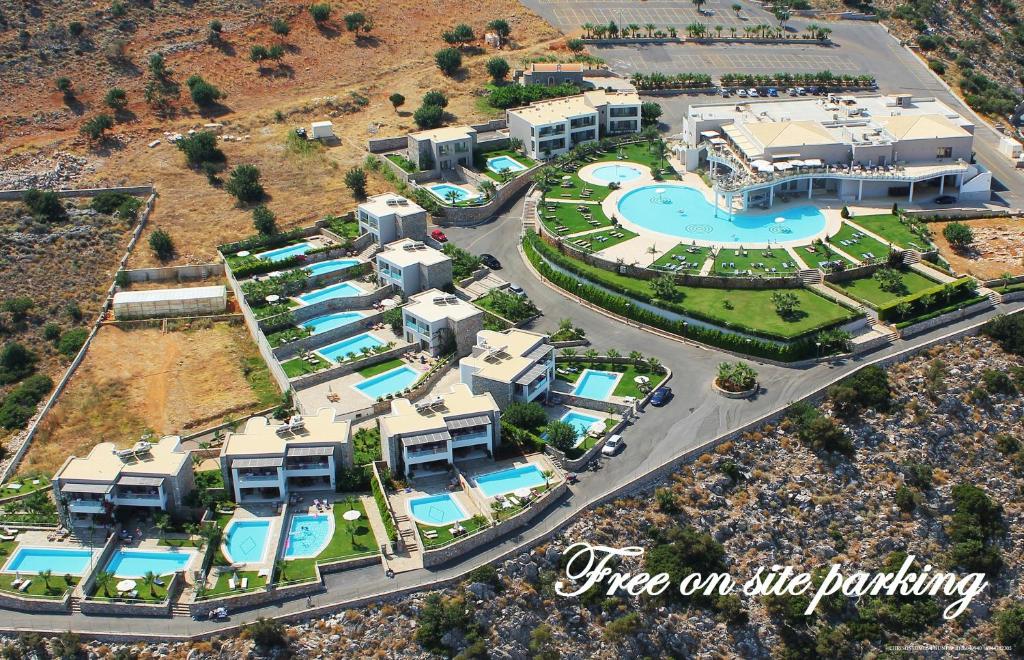 an aerial view of a resort with a swimming pool at Royal Heights Resort Villas & Spa in Malia