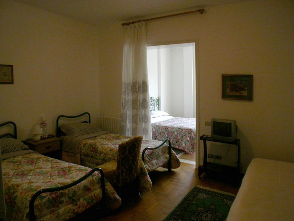 Postel nebo postele na pokoji v ubytování B&B Al Giardino
