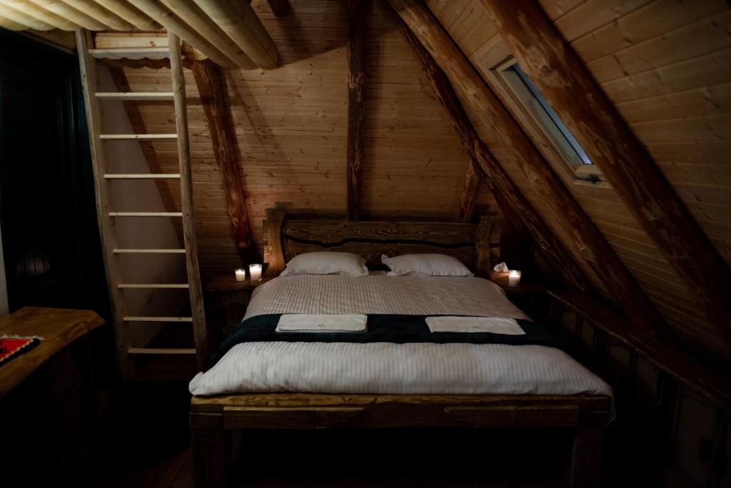 Postel nebo postele na pokoji v ubytování Huta Village