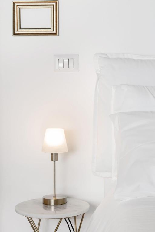 Łóżko lub łóżka w pokoju w obiekcie Ripa Apartments Milano - Ripa 57