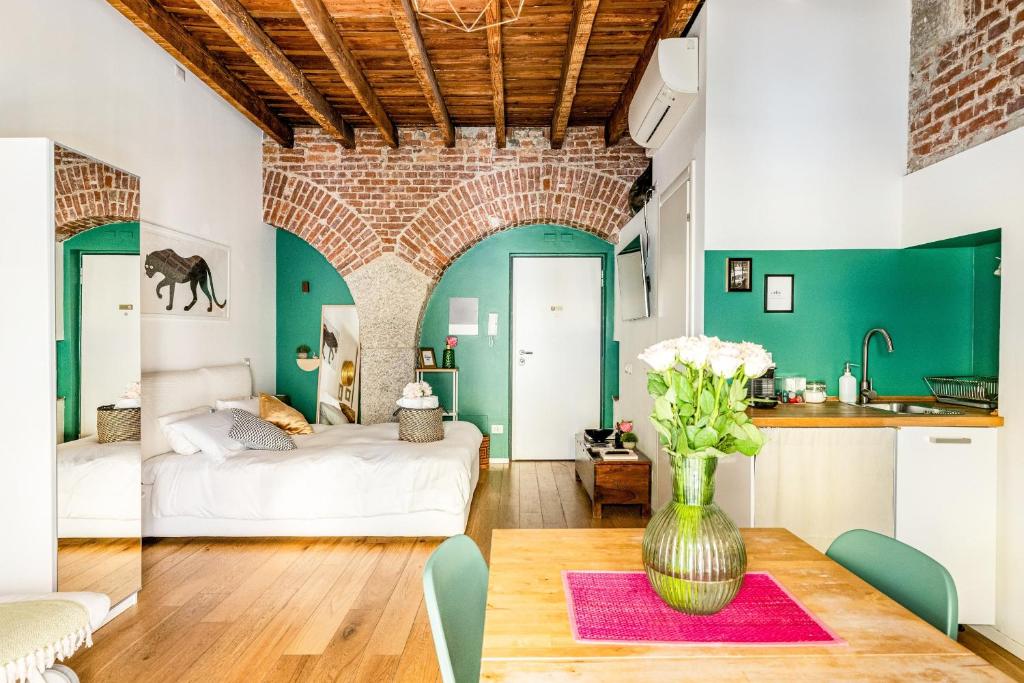 Łóżko lub łóżka w pokoju w obiekcie Ripa Apartments Milano - Ripa 57