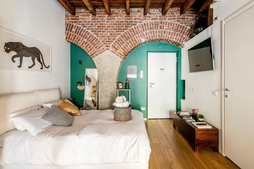 Łóżko lub łóżka w pokoju w obiekcie Ripa Apartments Milano - Ripa 57