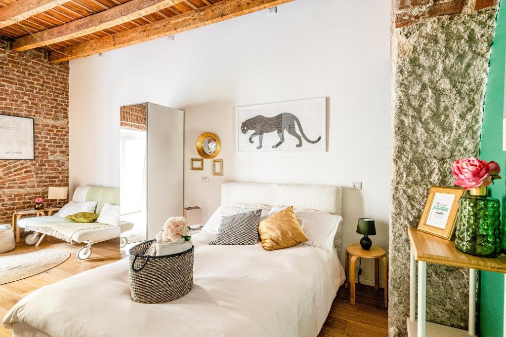 Łóżko lub łóżka w pokoju w obiekcie Ripa Apartments Milano - Ripa 57