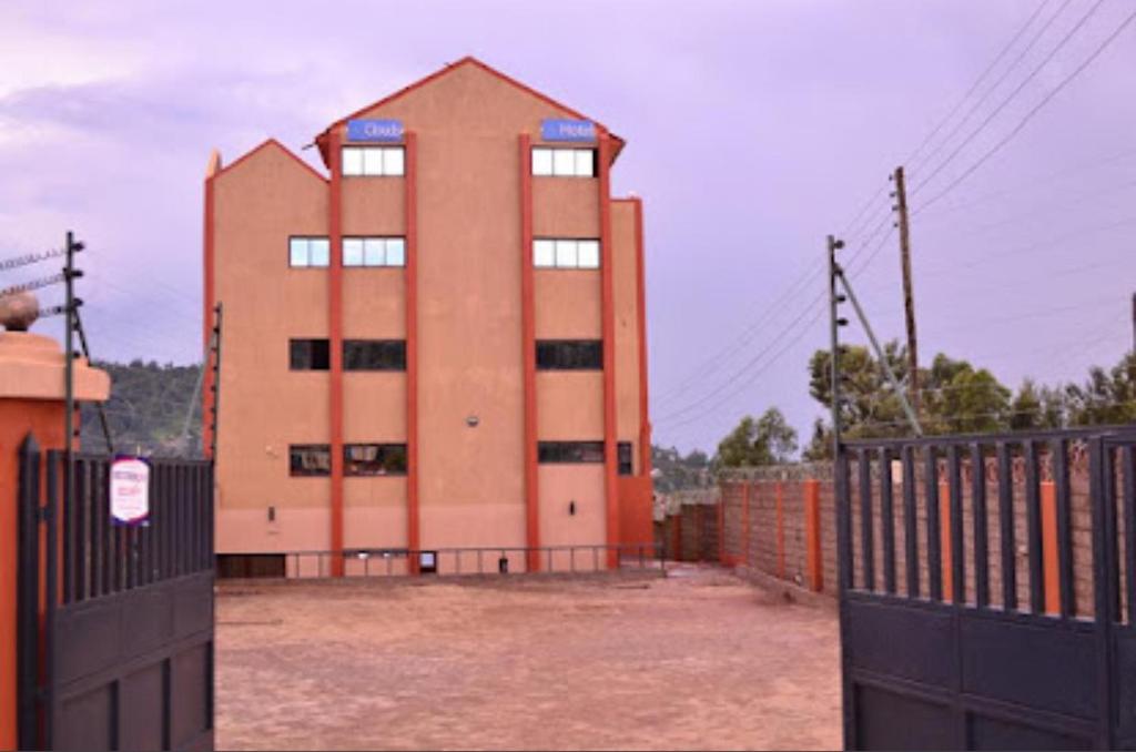 a building with a fence in front of it at Nuri Homes in Kisii