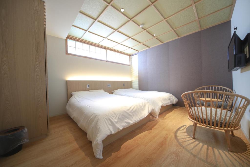 Postel nebo postele na pokoji v ubytování 利々 京都 lili hotel kyoto