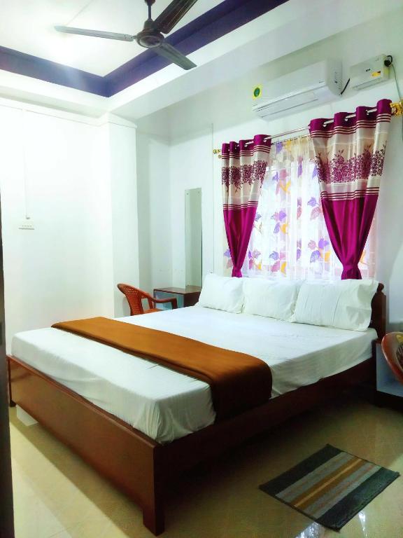 Postel nebo postele na pokoji v ubytování Continental Homestay