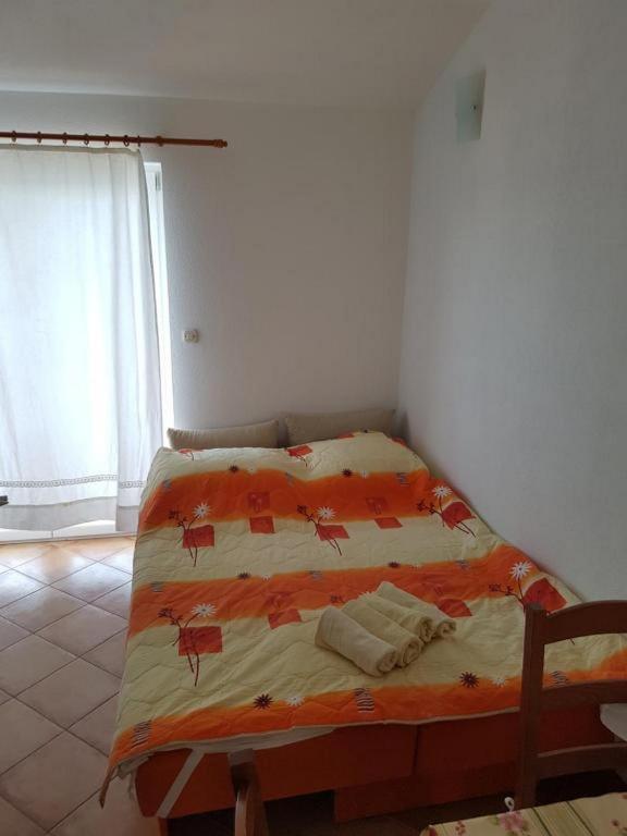 Postel nebo postele na pokoji v ubytování Apartmani Jereb
