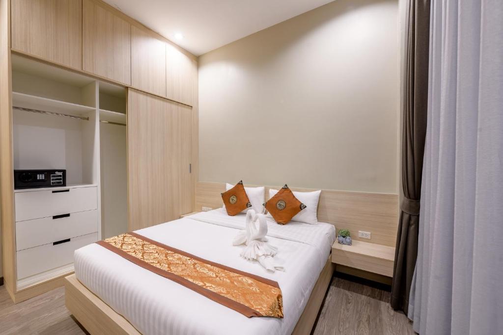 Postel nebo postele na pokoji v ubytování UR The Private Huahin