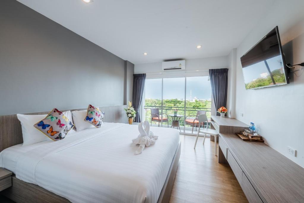 Postel nebo postele na pokoji v ubytování UR The Private Huahin