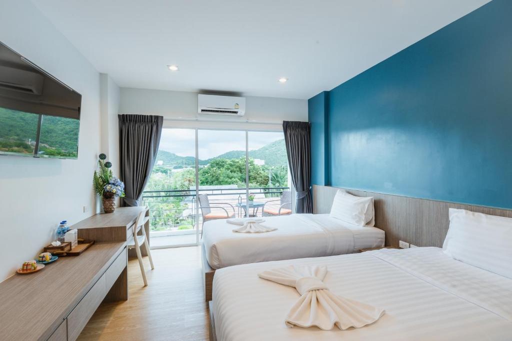 Postel nebo postele na pokoji v ubytování UR The Private Huahin