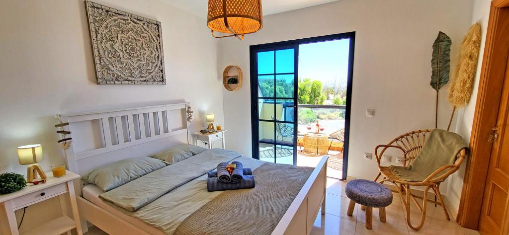 Postel nebo postele na pokoji v ubytování CASA BELLA VISTA
