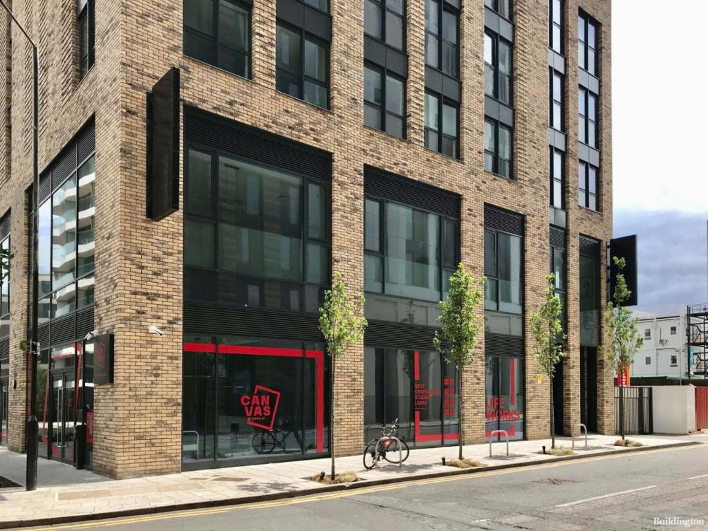 a brick building with a bike parked in front of it at Private Bedrooms with Shared Kitchen, Studios and Apartments at Canvas Wembley in London in London