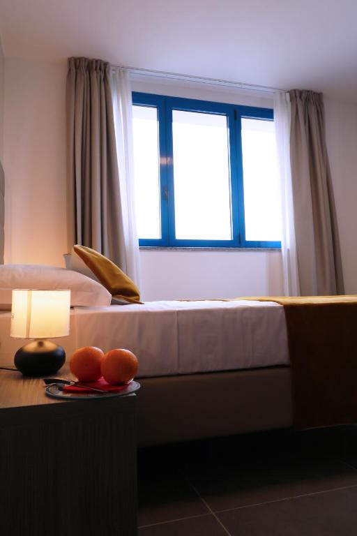 Postel nebo postele na pokoji v ubytování Blu Hotel