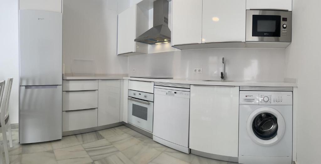 Kuchyňa alebo kuchynka v ubytovaní Apartamentos Registro Ronda Centro