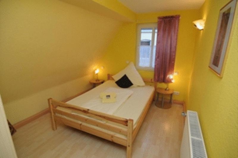 Postel nebo postele na pokoji v ubytování Hotel Hirsch Garni