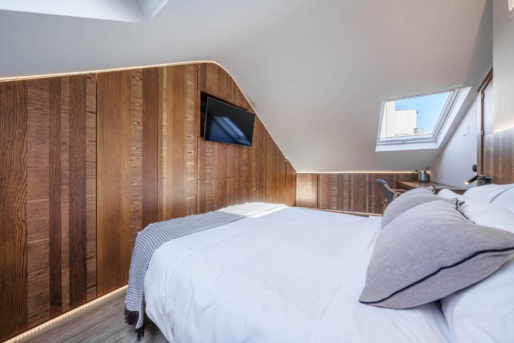 Posteľ alebo postele v izbe v ubytovaní Apartamentos Gibralfaro Centro