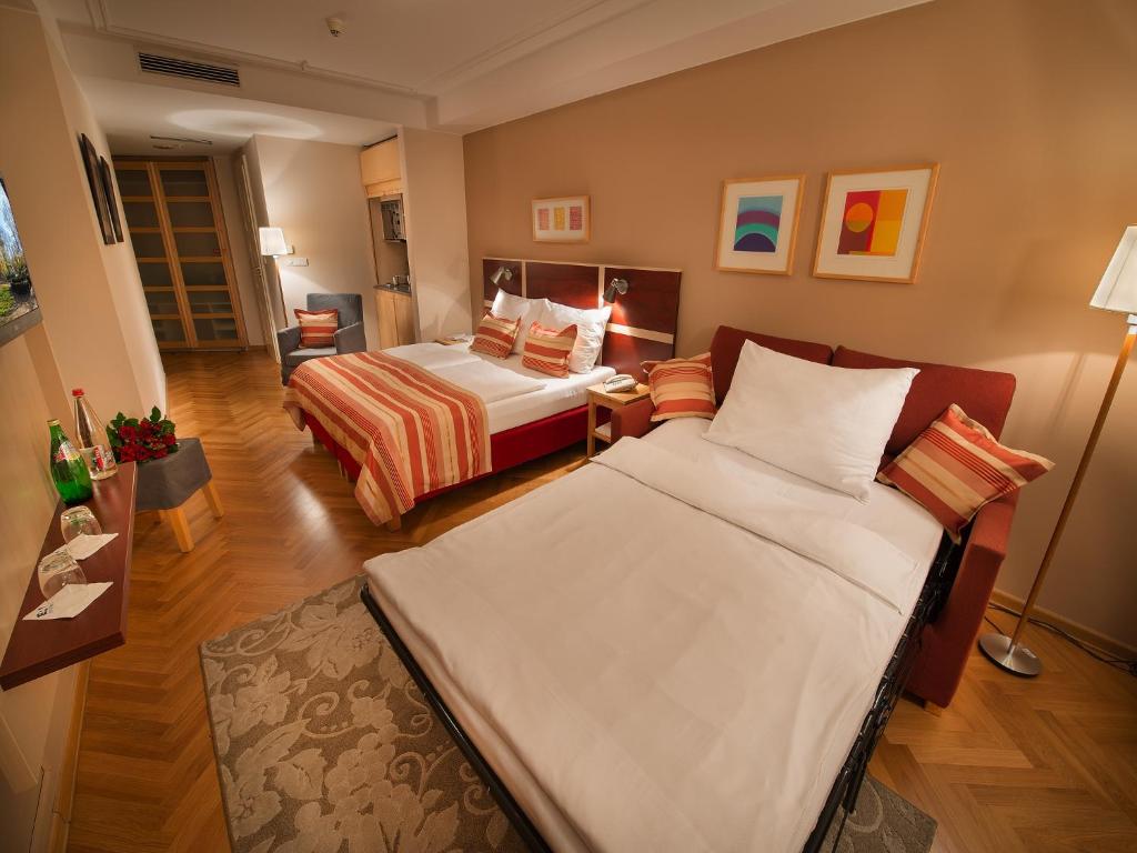 Postel nebo postele na pokoji v ubytování EA Hotel Julis