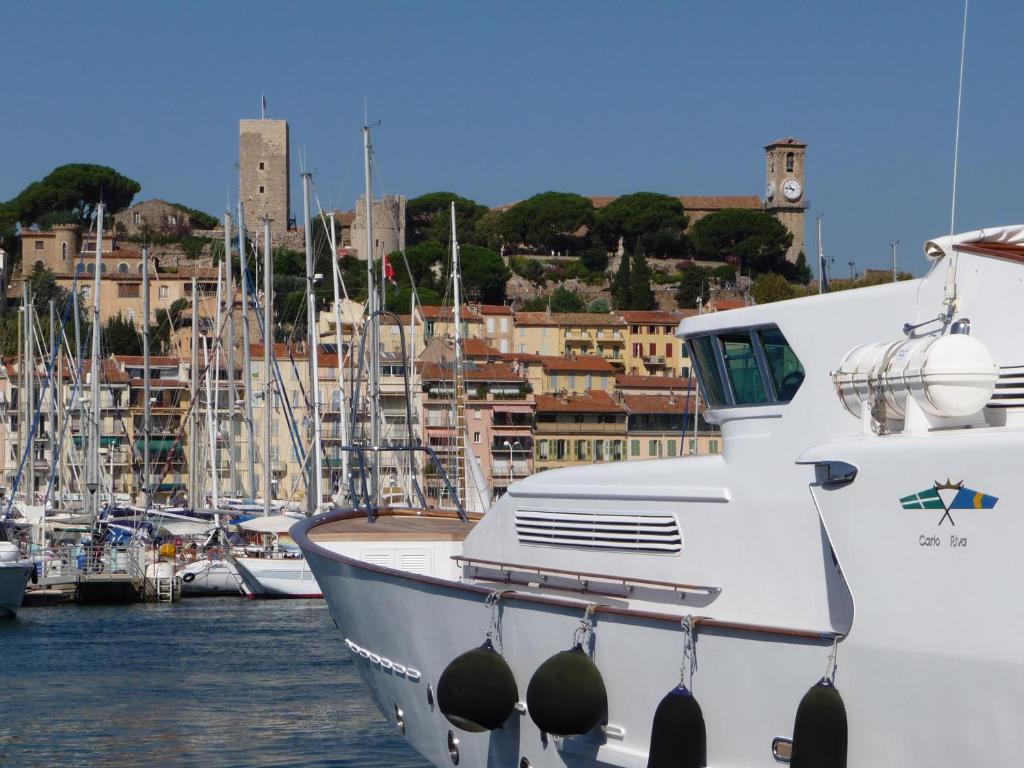 a boat is docked in a harbor with other boats at Very pleasant 2 rooms garage near the beaches in Cannes