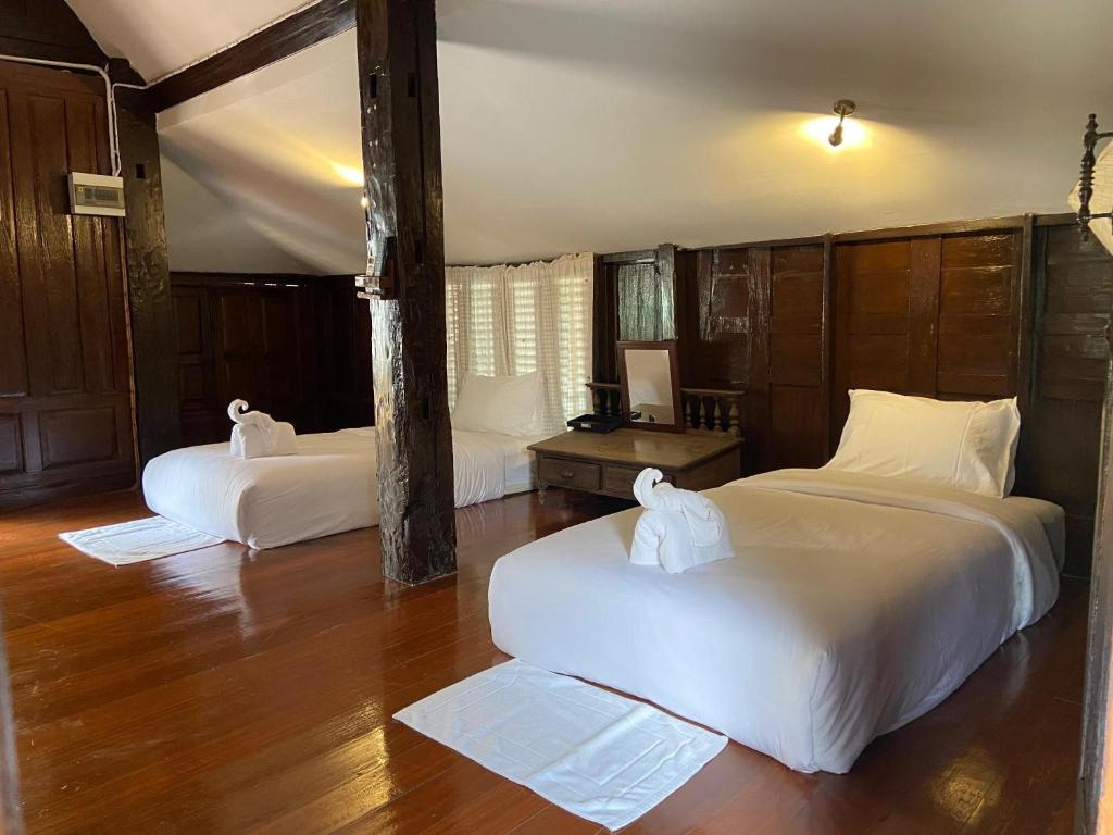 Postel nebo postele na pokoji v ubytování DONPIN8-Timeless House Chiang Mai