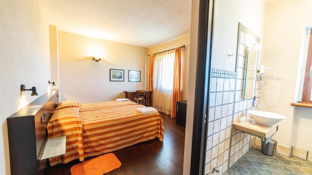 Postel nebo postele na pokoji v ubytování Sogni di Langa