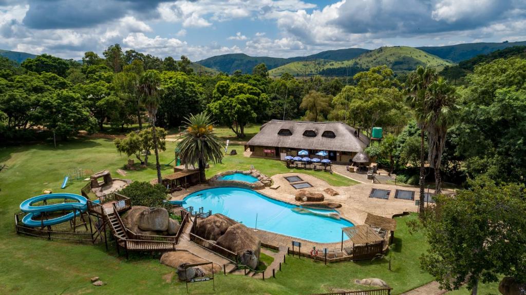 an aerial view of a resort with a swimming pool at Gooderson Leisure Natal Spa Self Catering and Timeshare Resort in Paulpietersburg