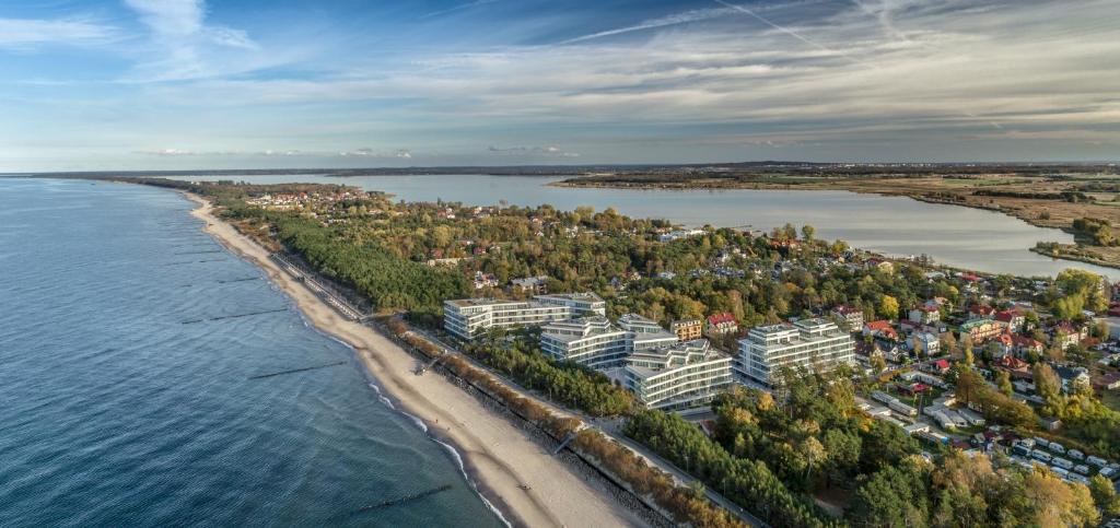 an aerial view of a city next to the water at Dune Beach Resort - C in Mielno