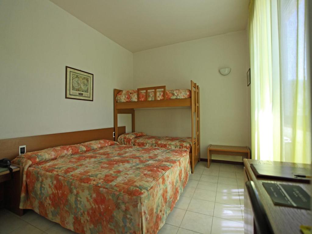 Postel nebo postele na pokoji v ubytování Euro Hotel