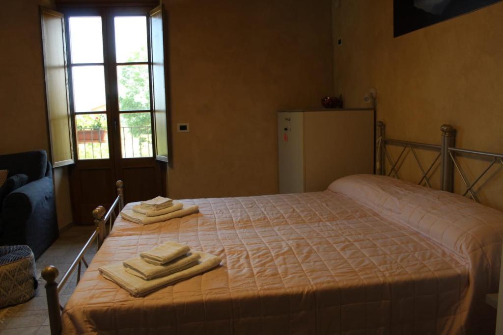 Postel nebo postele na pokoji v ubytování Appartamento del Monastero