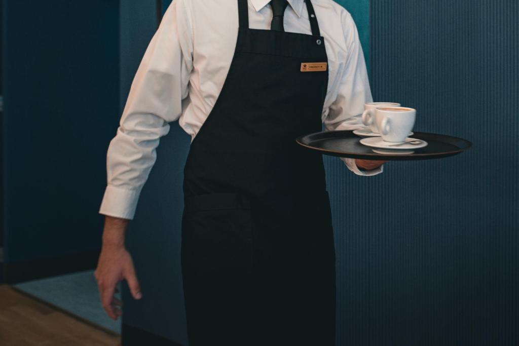 Příslušenství pro přípravu čaje a kávy v ubytování Hotel Royal Continental