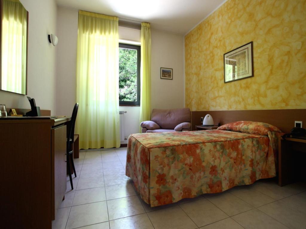Postel nebo postele na pokoji v ubytování Euro Hotel