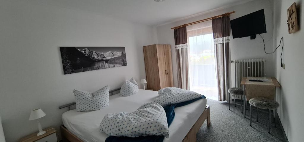 Postel nebo postele na pokoji v ubytování Alpenlandhaus