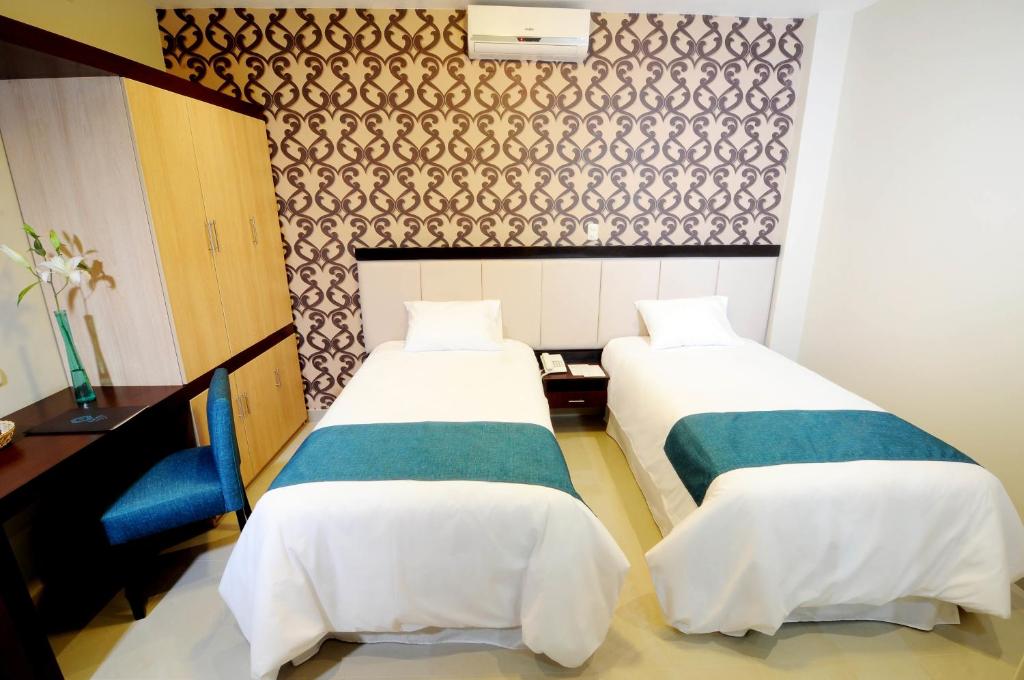 Postel nebo postele na pokoji v ubytování Dom Hotel